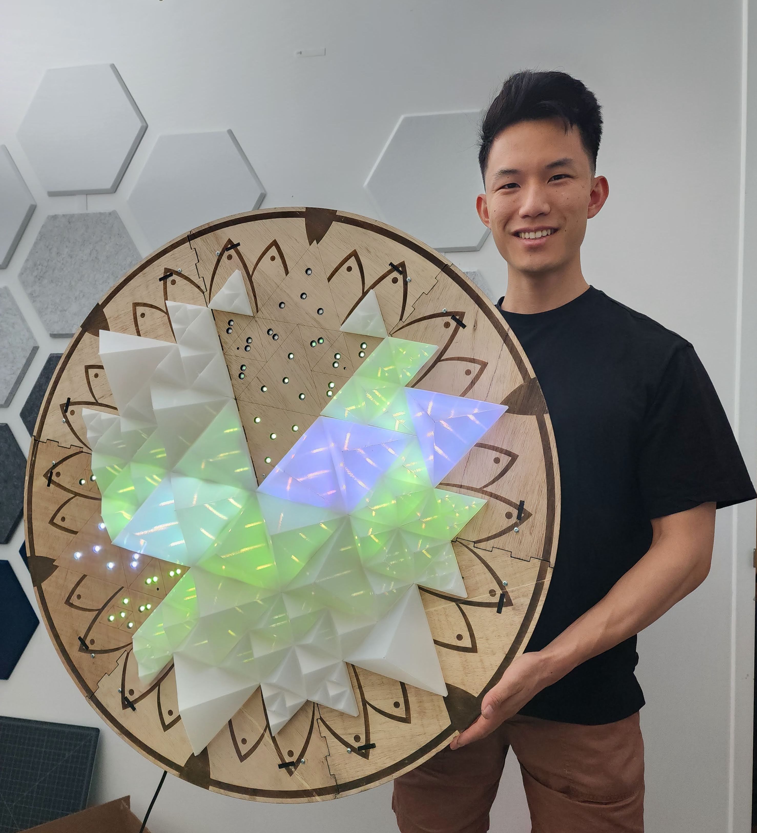 David Liu with an LED art installation